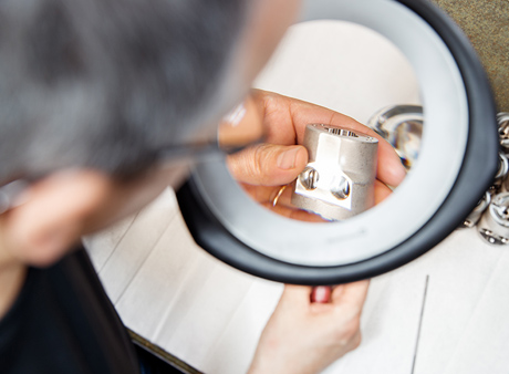 Diener Precision Pumps: Picture of engineer with magnifying glass